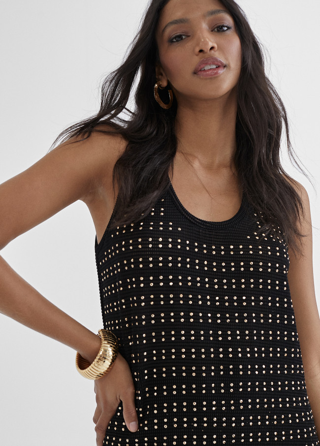Top long avec pièces métalliques