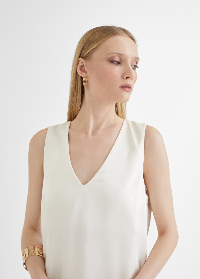 Top long avec fentes