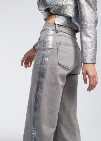 Trousers with laminated detail