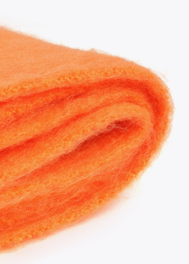 Scarf with braided fringing