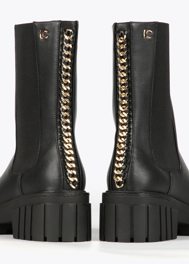 Black ankle boots with chain