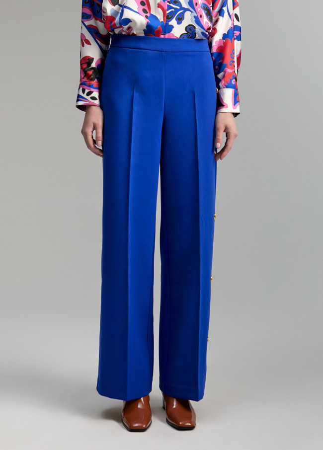 Pantaloni dettaglio di bottoni automatici