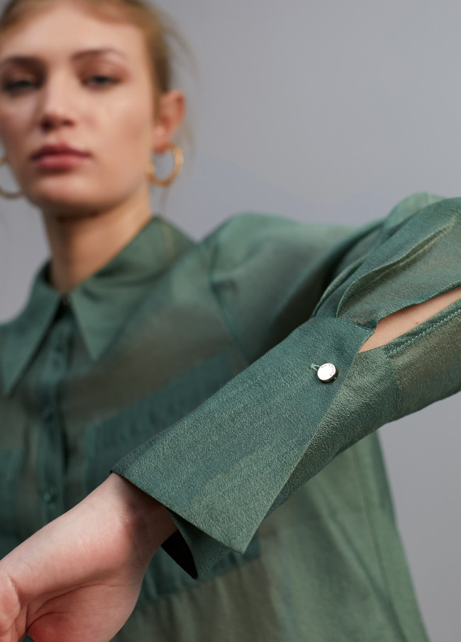 Blusa bolsillos transparencia