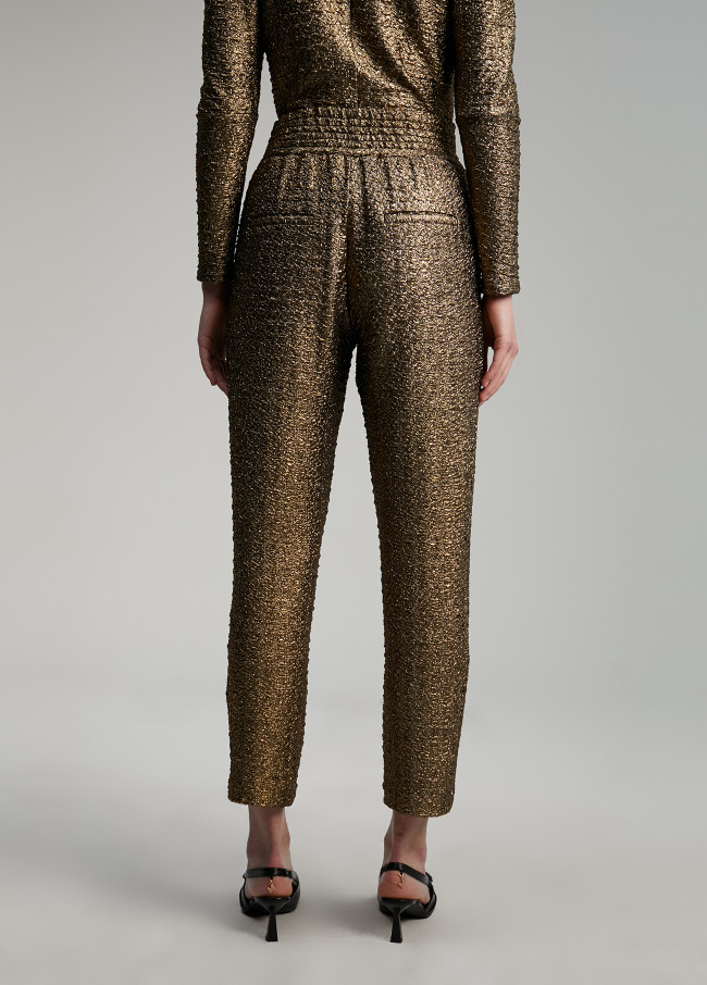 Calças jogger em dourado