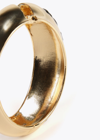 Gold-toned bracelet with slogan