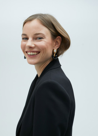 Gold-toned earrings with black heart