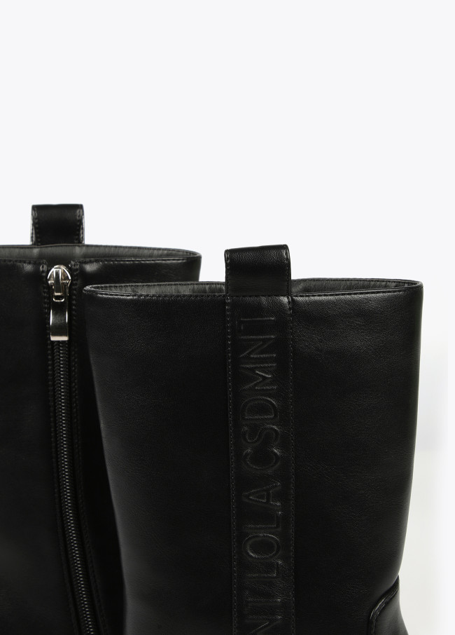 Square toe cowboy boots with metal decorations