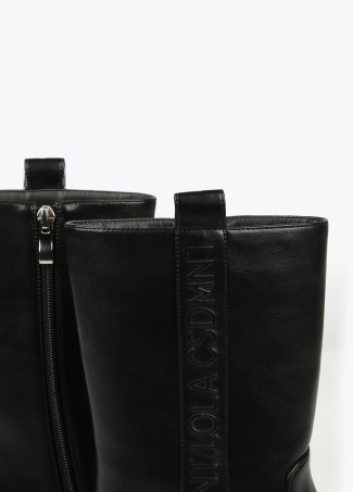 Square toe cowboy boots with metal decorations