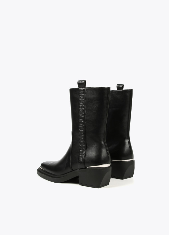 Square toe cowboy boots with metal decorations