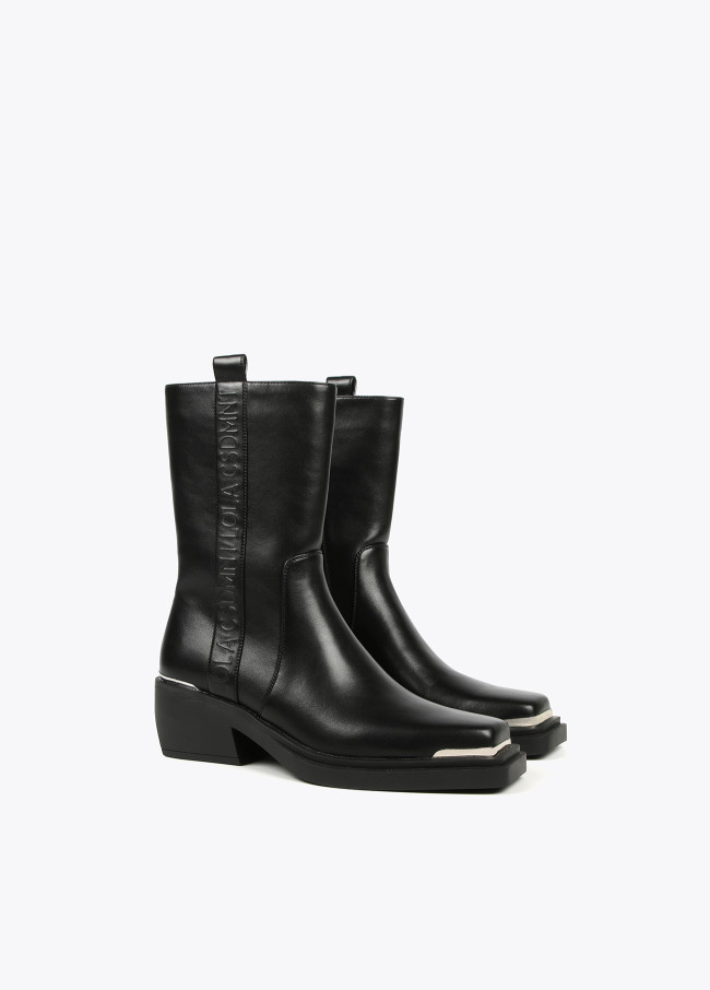 Square toe cowboy boots with metal decorations