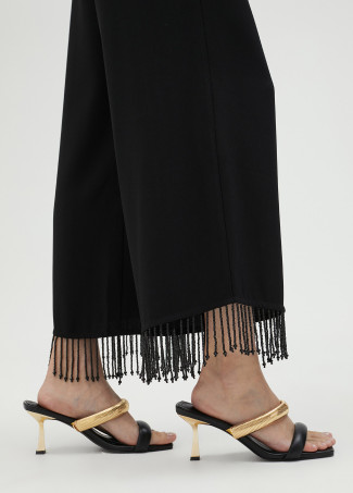 Trousers with fringing and rhinestones