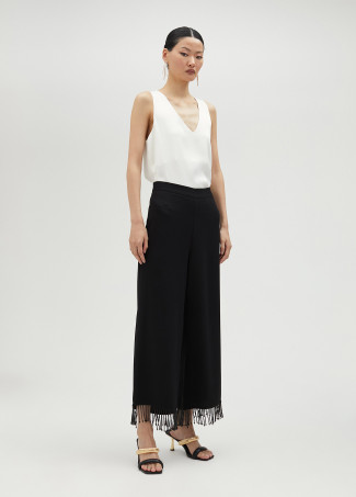Trousers with fringing and rhinestones