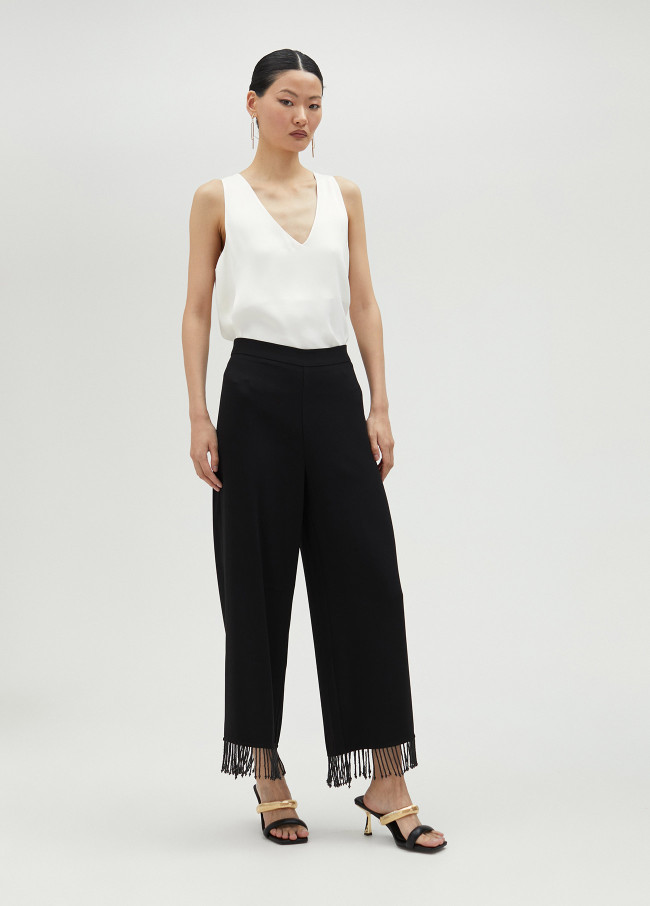 Trousers with fringing and rhinestones