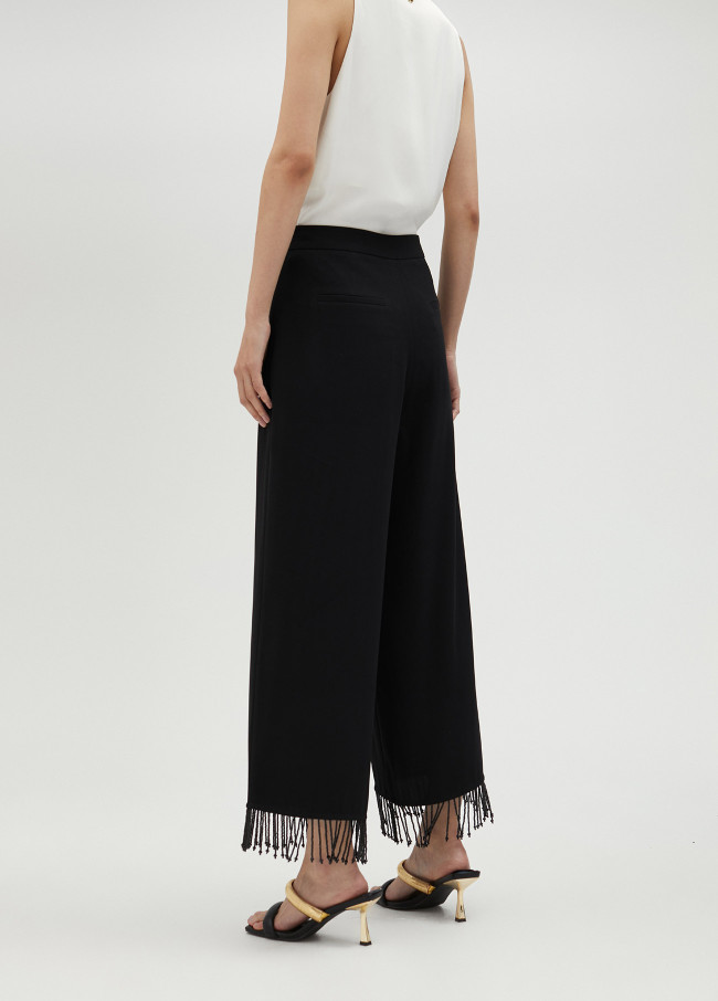 Pantalón con flecos y pedrería