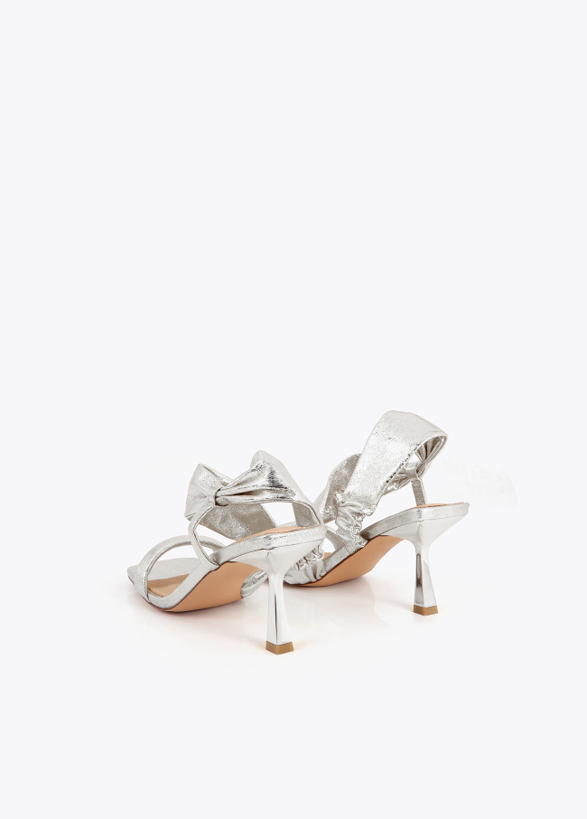 Heeled sandals with metallic straps
