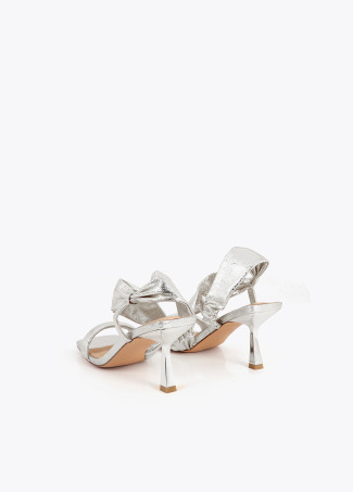 Heeled sandals with metallic straps