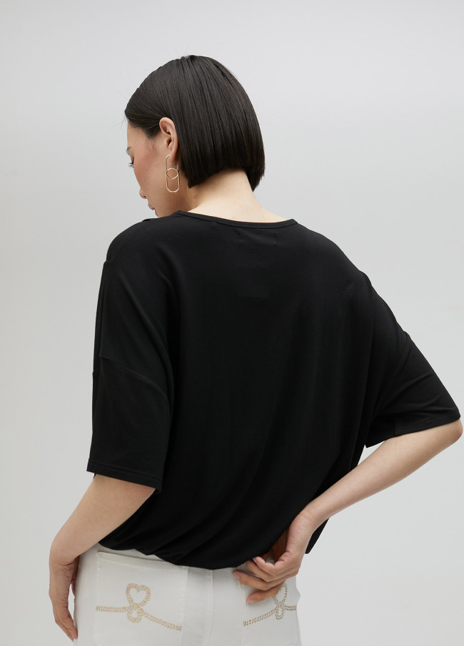 T-shirt avec nœud dans le bas