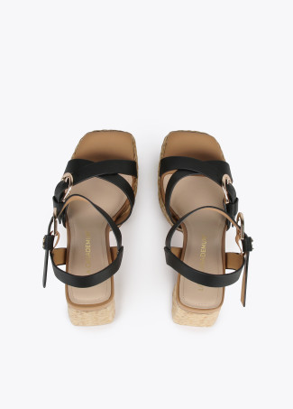 Heeled sandals with buckles