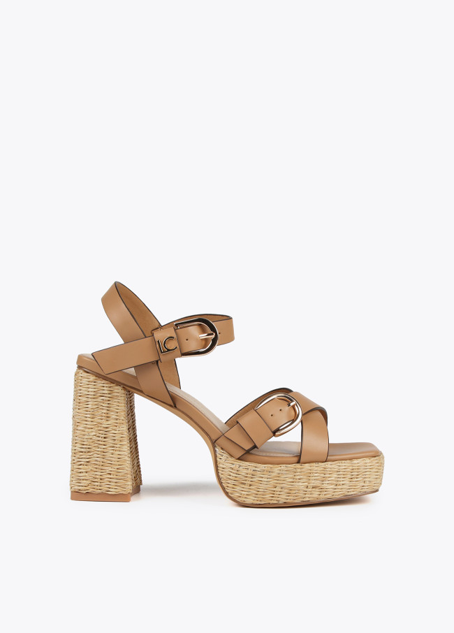 Heeled sandals with buckles