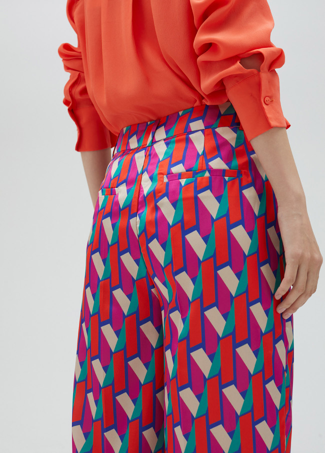 Palazzo trousers in multicoloured logo print