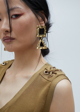 Top en maille détail œillets