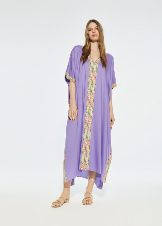 Túnica comprida com rebordo