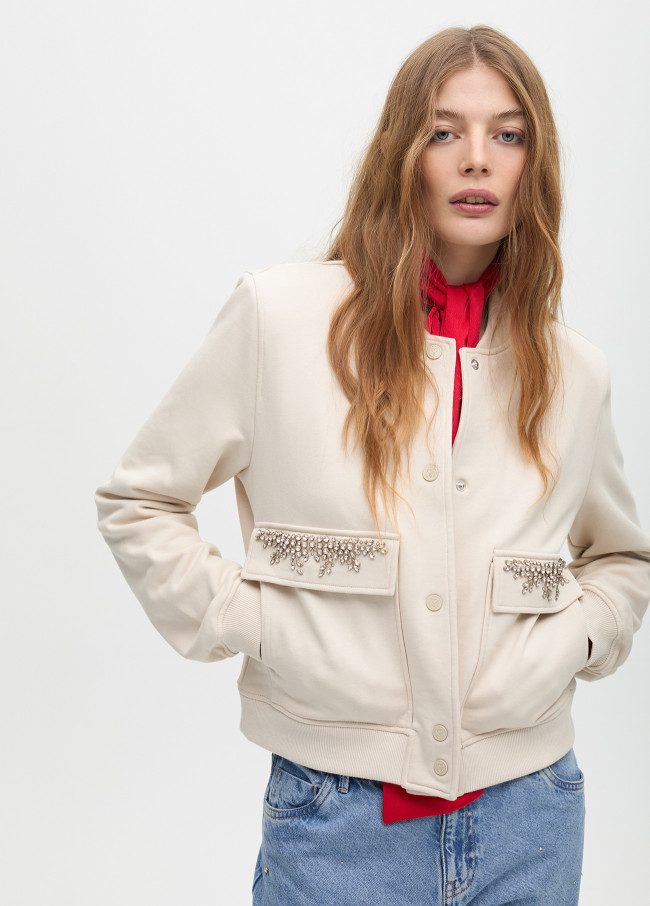 Bomber jacket with jeweled pocket detail