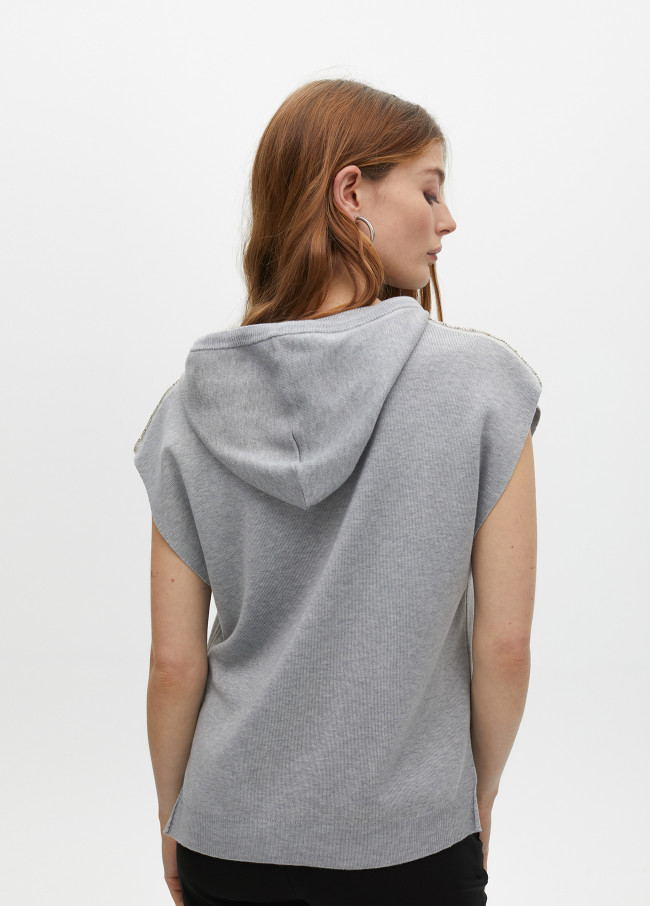 Sweater vest with hood and shoulder appliqués