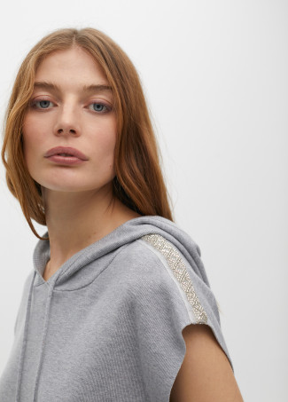 Sweater vest with hood and shoulder appliqués