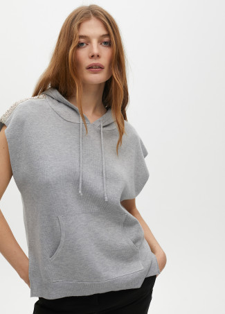 Sweater vest with hood and shoulder appliqués