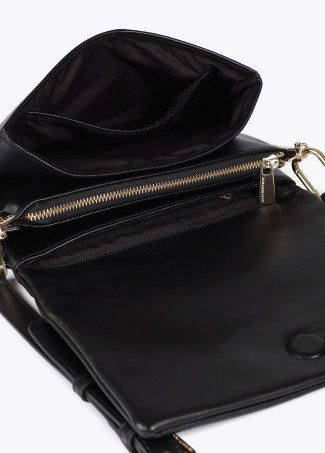 Faux leather crossbody bag with three compartments and flap.