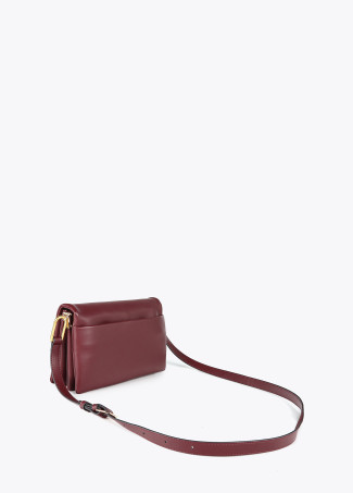 Faux leather crossbody bag with three compartments and flap.