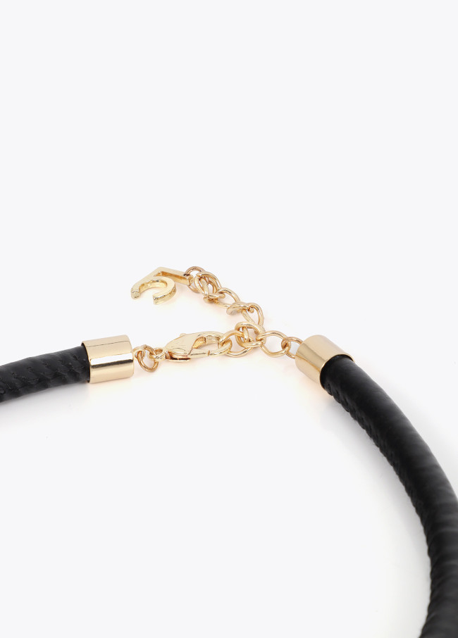 Short faux leather tube necklace with cutwork...