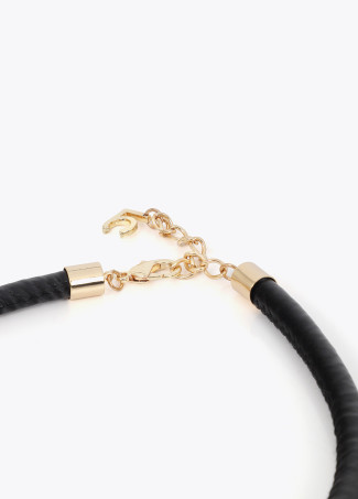 Short faux leather tube necklace with cutwork metal logo