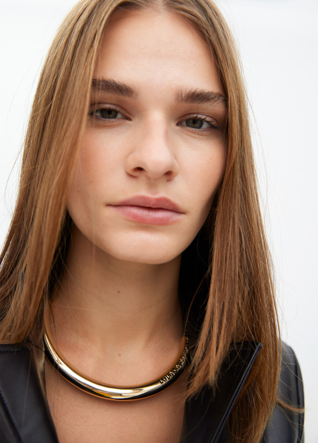 Short faux leather tube necklace with cutwork...