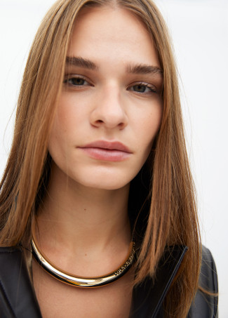 Short faux leather tube necklace with cutwork metal logo