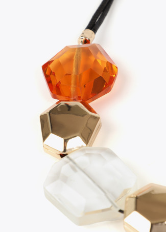 Cord necklace with contrast geometric pieces