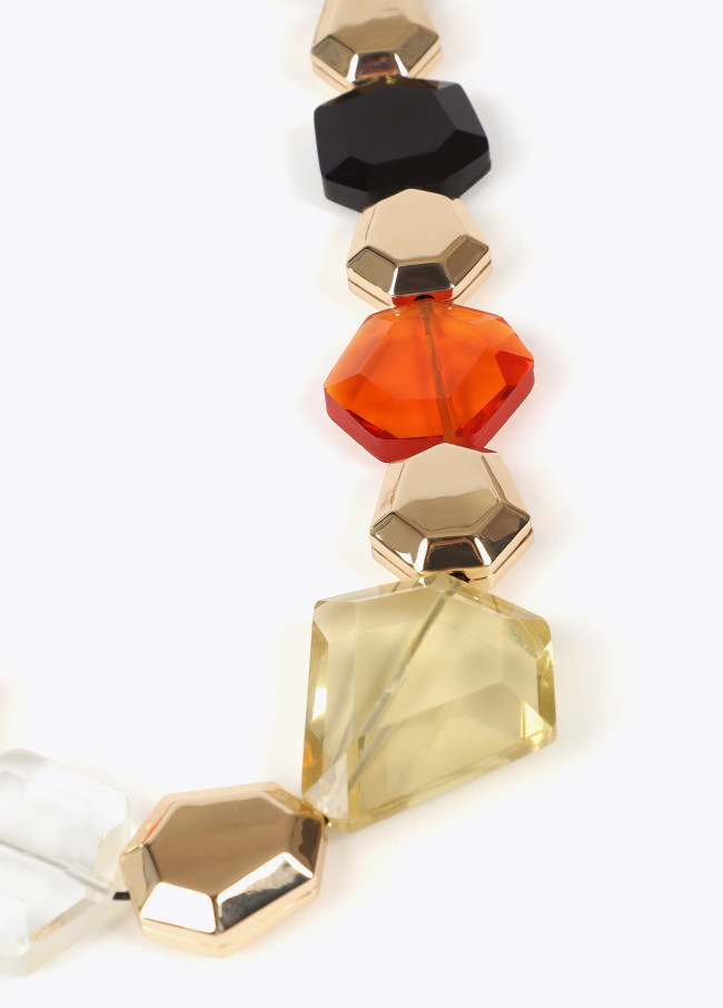 Cord necklace with contrast geometric pieces