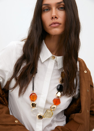 Cord necklace with contrast geometric pieces