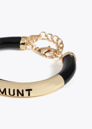 Acrylic tube bracelet with metal cutwork logo