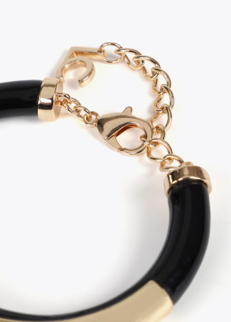 Acrylic tube bracelet with metal cutwork logo