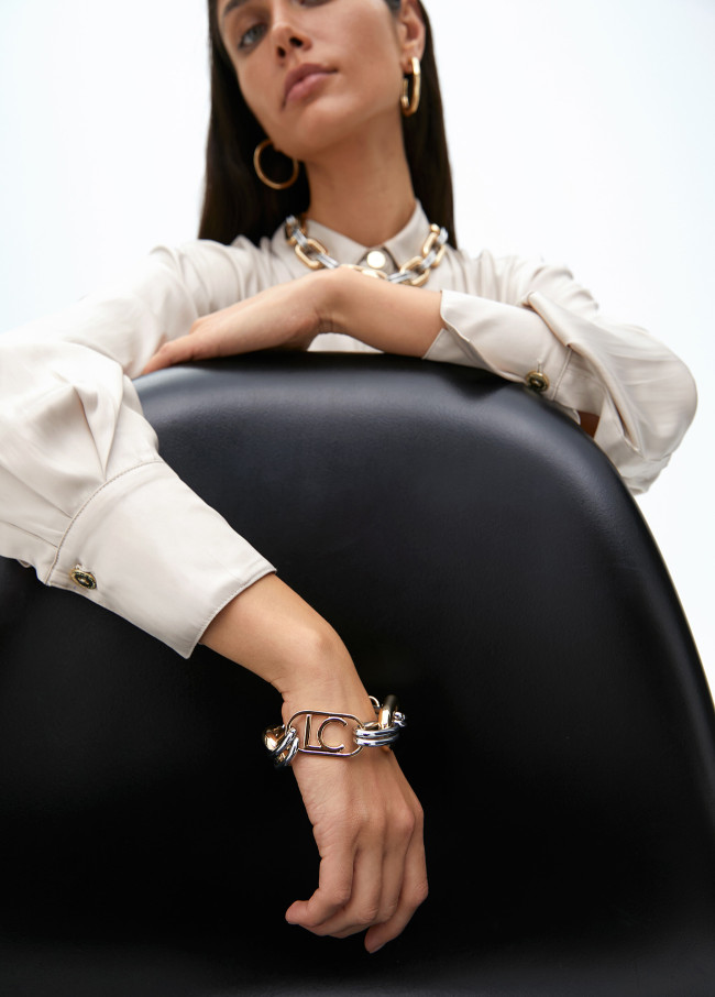 Two-tone chain link bracelet with oval logo