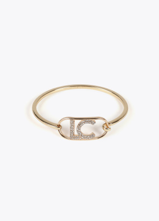 Rigid thin bangle with oval logo