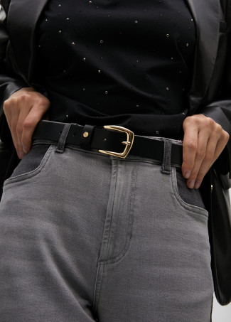 Belt with cutwork logo