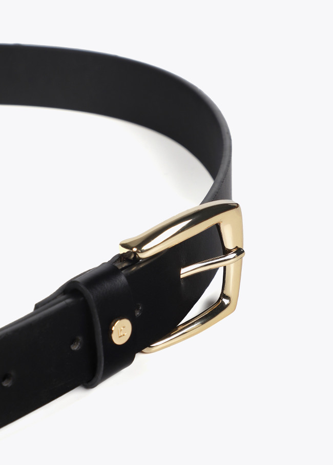 Belt with cutwork logo