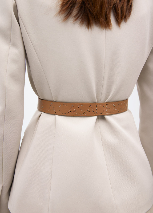 Belt with cutwork logo
