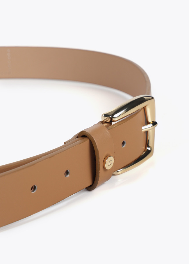 Belt with cutwork logo