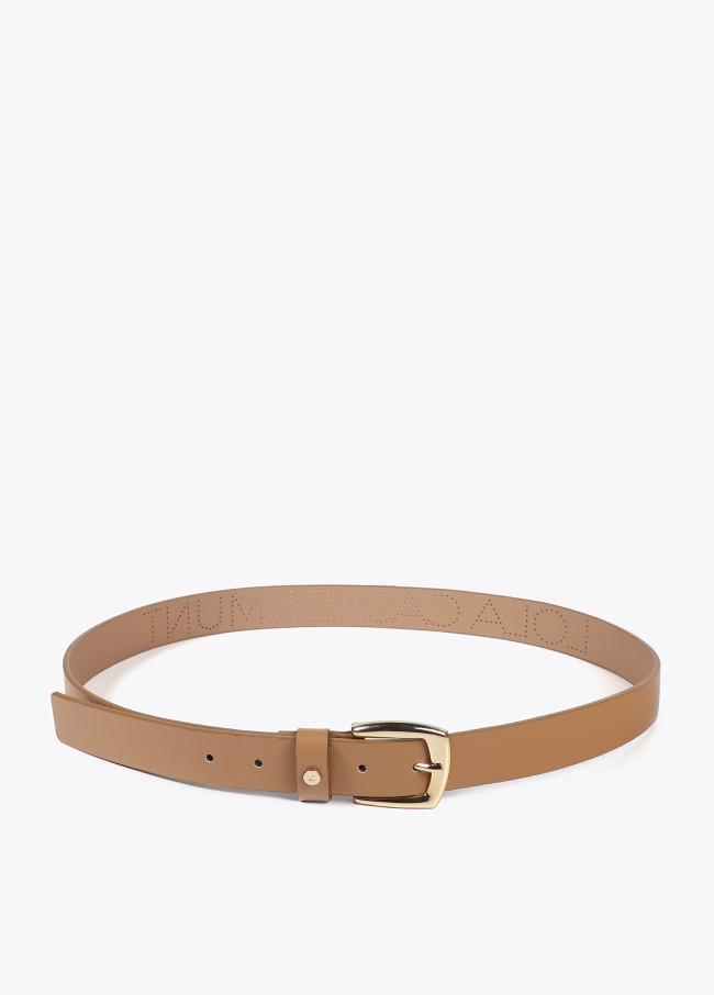 Belt with cutwork logo