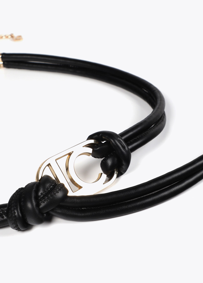 Faux leather strappy belt with oval logo