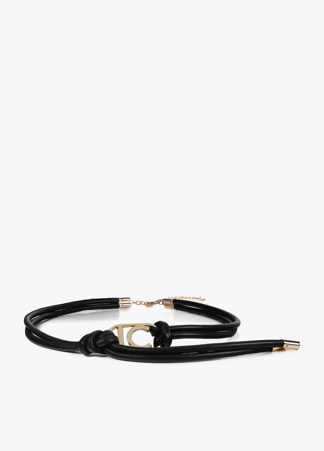 Faux leather strappy belt with oval logo